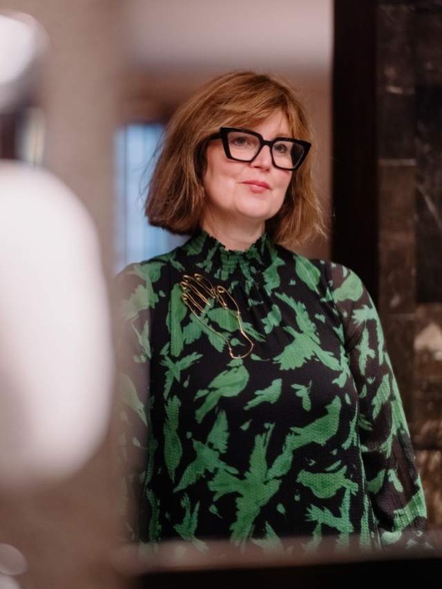 Lucy Littlewood, photographed in a museum interior.